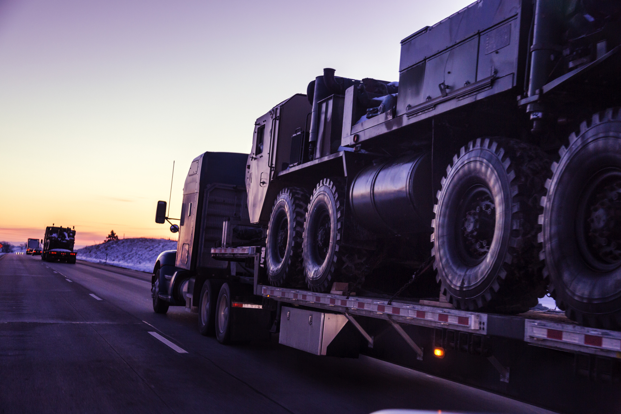 Truck Hauling Military Equipment
